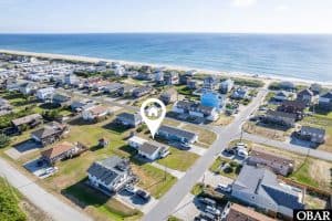 Modern beach house just steps from the OBX shoreline, perfect for vacation rentals or beachfront living.